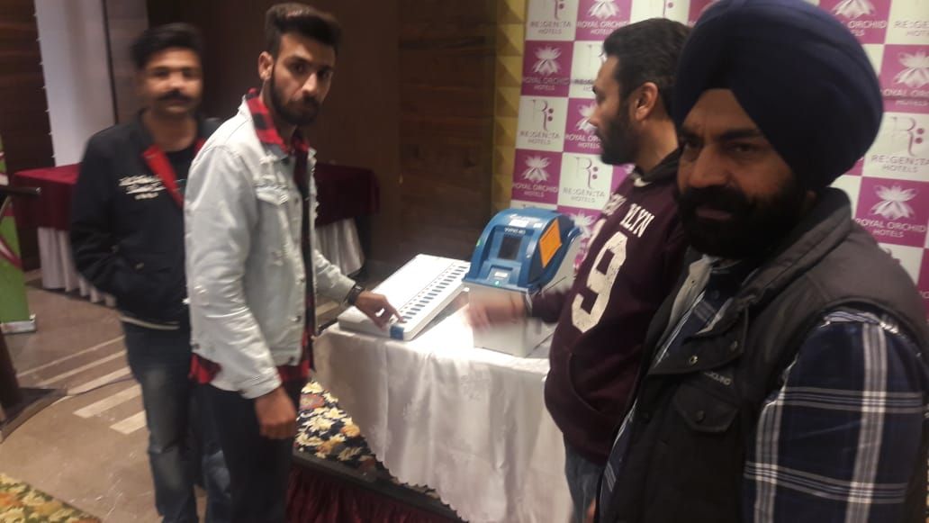 EVM Awareness camp at hotel Regenta central Amritsar, in collaboration with My FM RJ and other dignitaries casting votes at this event