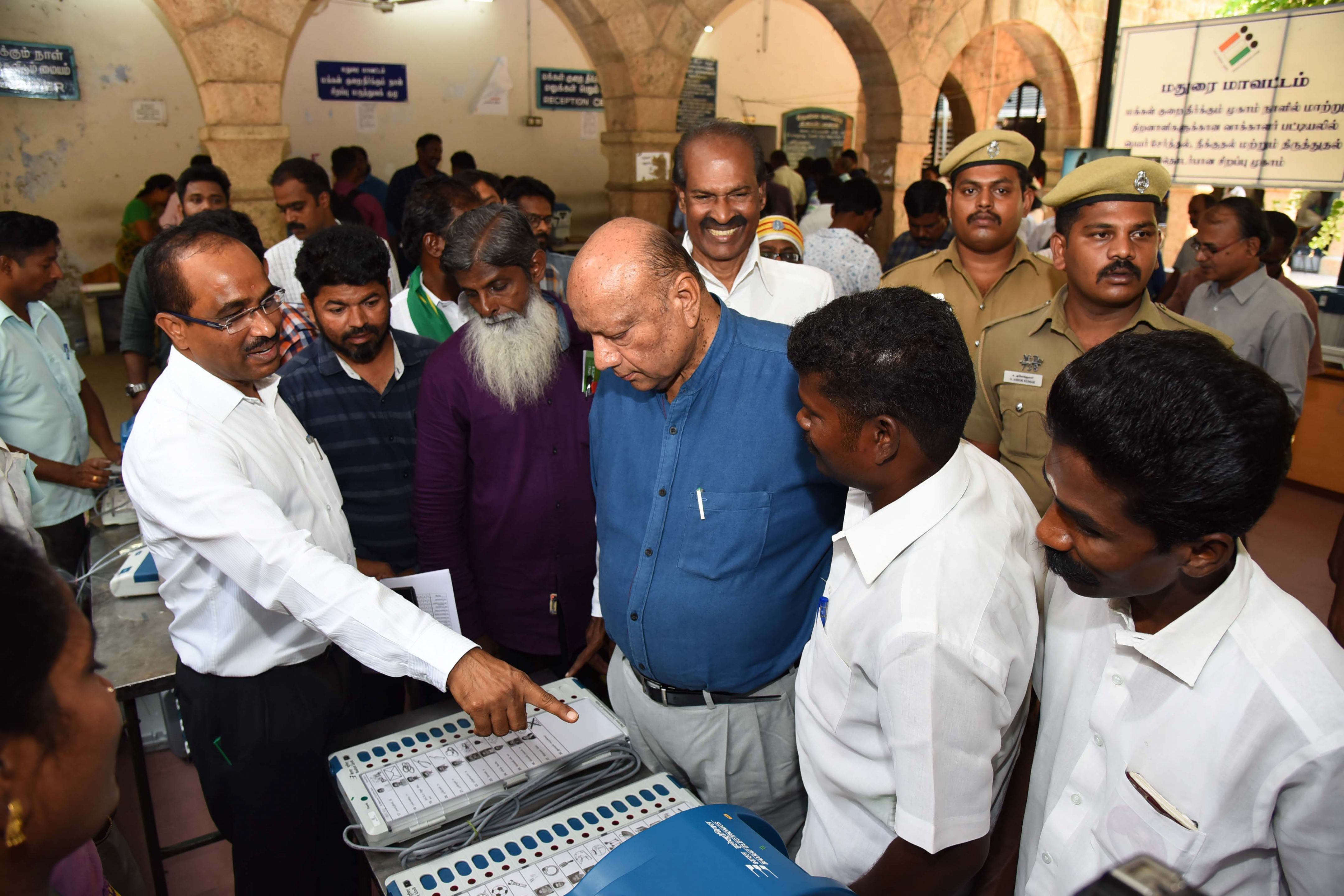 Madurai Parliamentary general observer,District collector/Returning officer,inspected the process of fixing candidate name and symbol on EVM machine on Madurai north-Collectorate campus at 08.04.2019.
